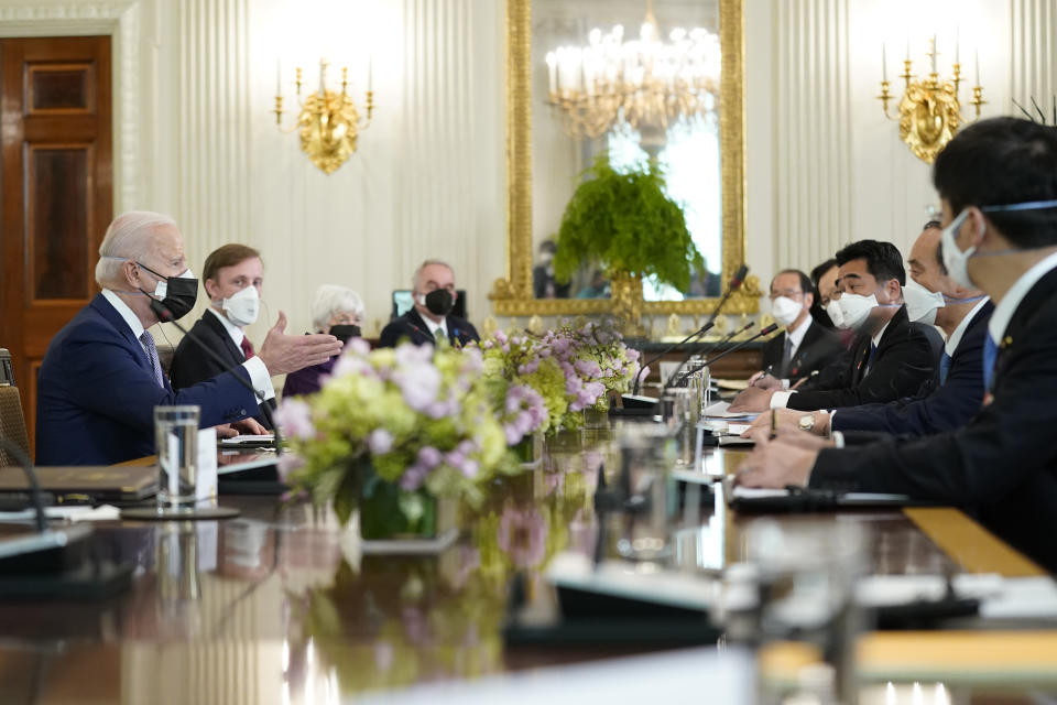 President Joe Biden meets with Japanese Prime Minister Yoshihide Suga in the State Dining Room of the White House, Friday, April 16, 2021, in Washington. (AP Photo/Andrew Harnik)