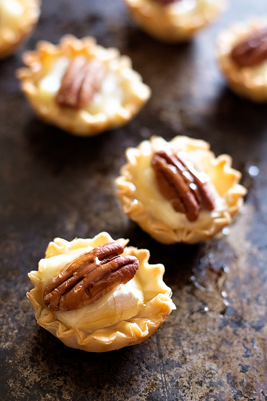 <p>Unicorns in the Kitchen</p><p>Rock your table with these easy pecan and brie phyllo cups and drizzle some honey on top to boost the flavor! All in 15 minutes and very little effort!</p><p><strong>Get the recipe: <a href="https://www.unicornsinthekitchen.com/brie-phyllo-cups/" rel="nofollow noopener" target="_blank" data-ylk="slk:Brie Phyllo Cups;elm:context_link;itc:0;sec:content-canvas" class="link rapid-noclick-resp"><em>Brie Phyllo Cups</em></a></strong></p>