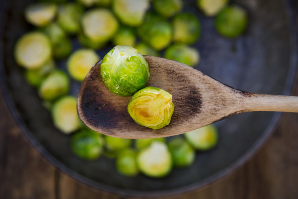 Brussels sprouts on a wooden spoon