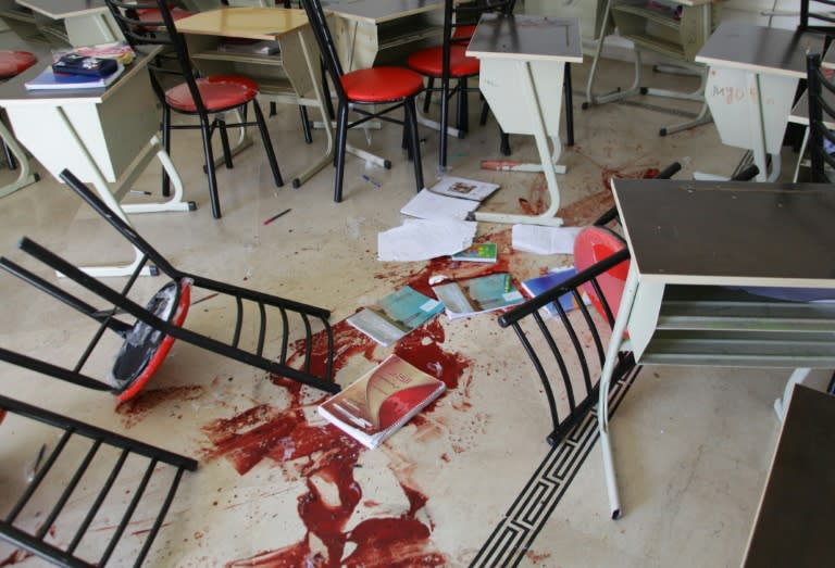 A picture shows the blood stained floor of a class room following rocket attacks carried out by Syrian rebels in the Shahba neighbourhood of the government-held side of Aleppo on October 27, 2016