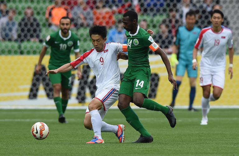 North Korea's Song Chol Pak and Saudi Arabia's Saud Kariri during their Asian Cup match in Melbourne on January 14, 2015