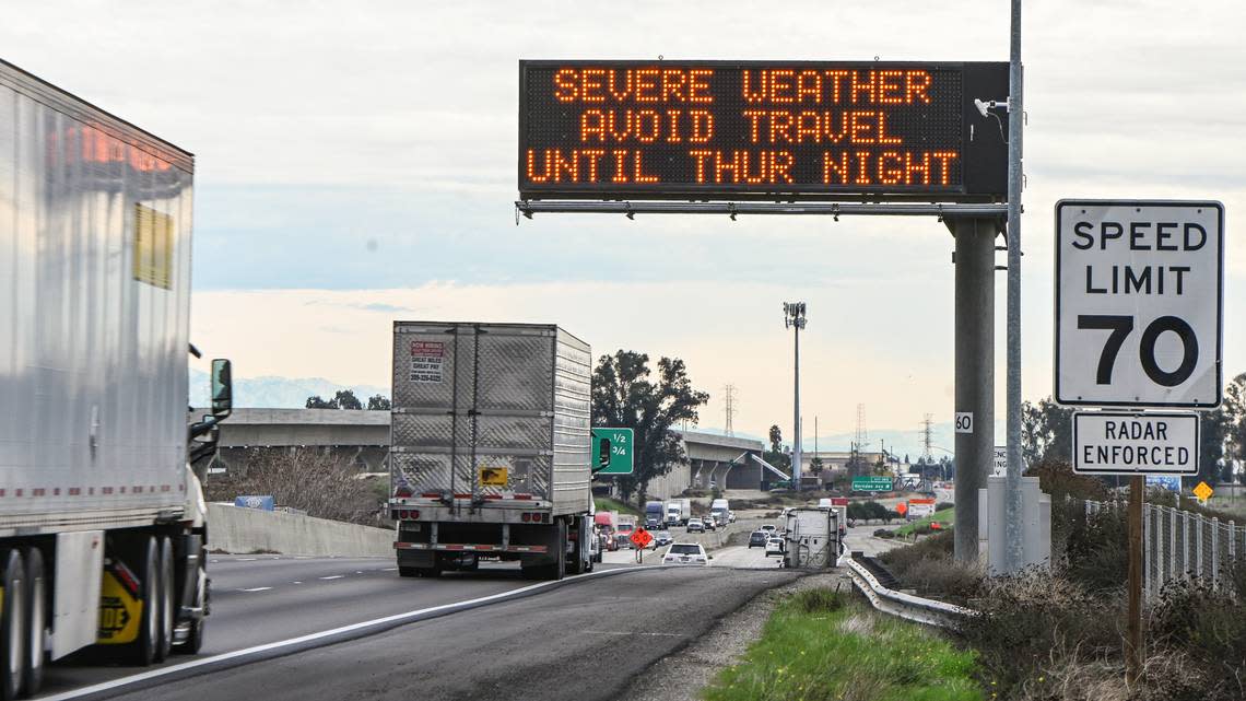 An electronic freeway sign on Highway 99 north of Fresno signals drivers to avoid travel through Thursday night as severe weather is forecast for the Central Valley, on Wednesday, Jan. 4, 2023.