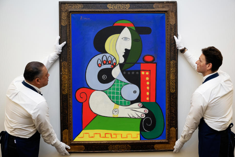 Sotheby's art handlers adjust Pablo Picasso's 