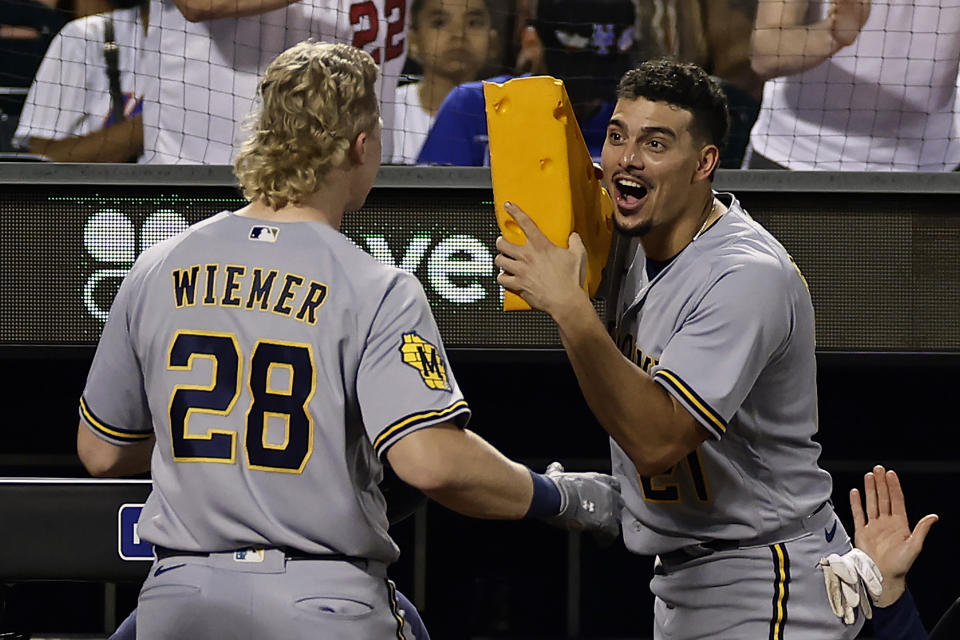 Milwaukee Brewers' Joey Wiemer (28) is congratulated by Willy Adames after hitting a two-run home run during the sixth inning of a baseball game against the New York Mets, Monday, June 26, 2023, in New York. (AP Photo/Adam Hunger)