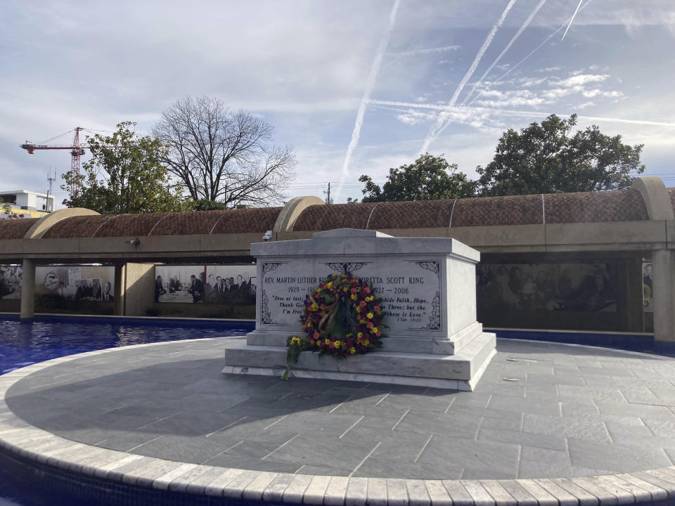 The tomb of Martin Luther King Jr. is pictured at Martin Luther King Jr. National Historical Park in Atlanta, Monday, Jan. 16, 2023, where hundreds of people gathered to commemorate the federal holiday honoring the slain civil rights leader. King was assassinated in 1968 and now is entombed alongside his wife, Coretta Scott King, on the campus that includes the old Ebenezer Baptist Church where he once preached, the church's new sanctuary and The King Center that seeks to carry on his work for nonviolent social action. (AP Photo/Bill Barrow)