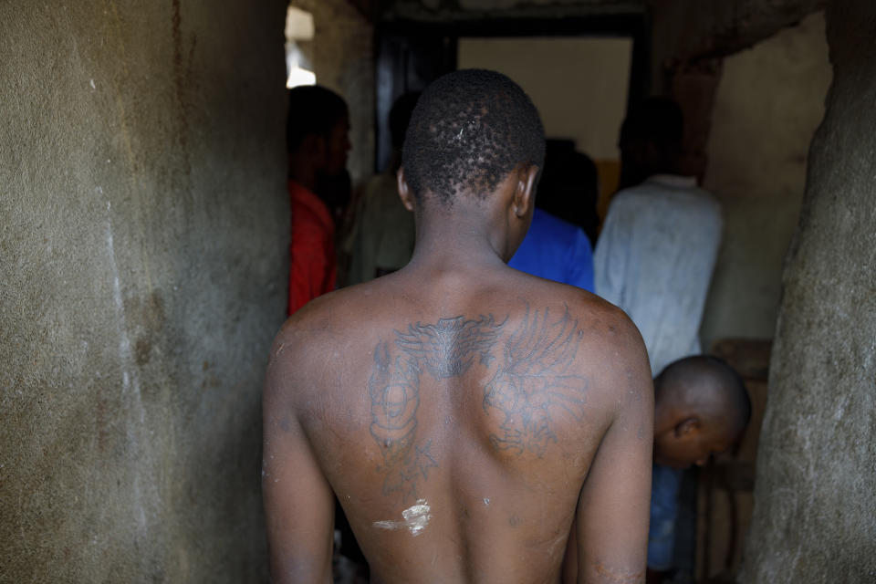 Kush users' queue to receive medical care at a medical outreach center of Sierra Leone's Youth Development and Child Link (SLYDCL), an NGO that provides medical care and psychological needs for drug users, Friday, April 26, 2024. (AP Photo/ Misper Apawu)