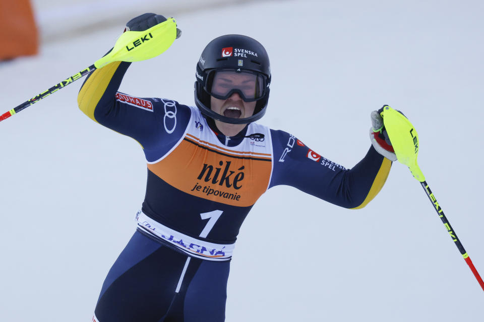 Sweden's Anna Swenn Larsson celebrates at the finish area of an alpine ski, women's World Cup slalom race, in Jasna, Slovakia, Sunday, Jan. 21, 2024. (AP Photo/Giovanni Maria Pizzato)