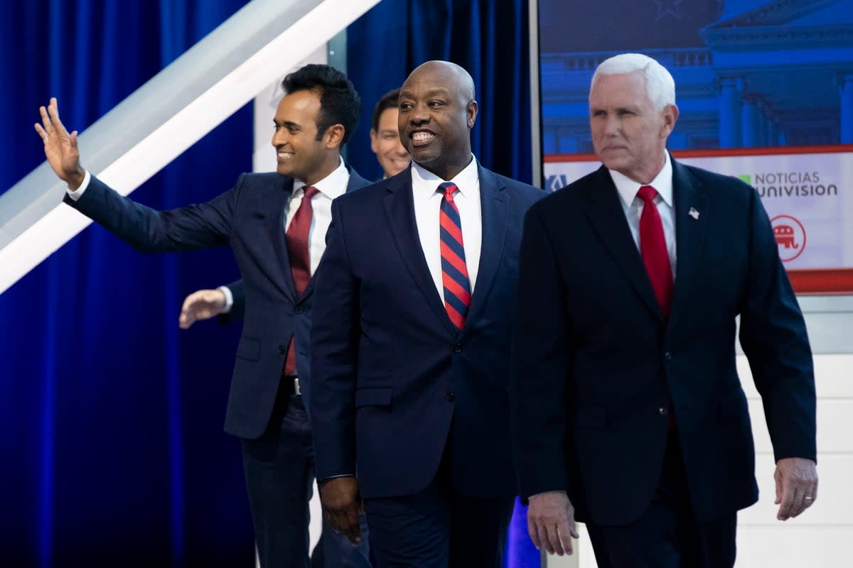 US entrepreneur Vivek Ramaswamy, South Carolina senator Tim Scott and former Vice President Mike Pence arrive on stage prior to the GOP FOX Business Presidential Debate at the Ronald Reagan Presidential Library in Simi Valley, California, USA, 27 September 2023 (EPA)
