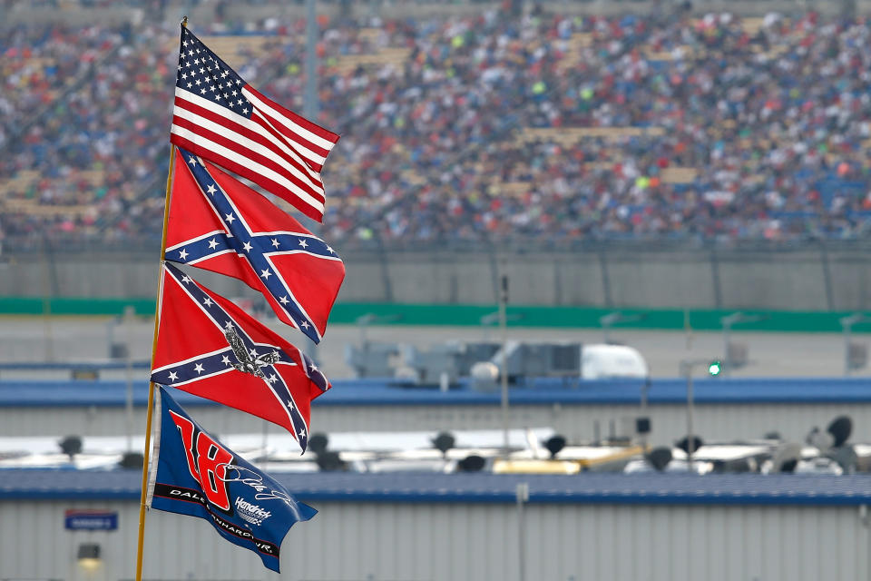 SPARTA, KY - JULY 11:  A view of American and Confederate flags seen flying over the infield during the NASCAR Sprint Cup Series Quaker State 400 presented by Advance Auto Parts at Kentucky Speedway on July 11, 2015 in Sparta, Kentucky.  (Photo by Todd Warshaw/Getty Images)