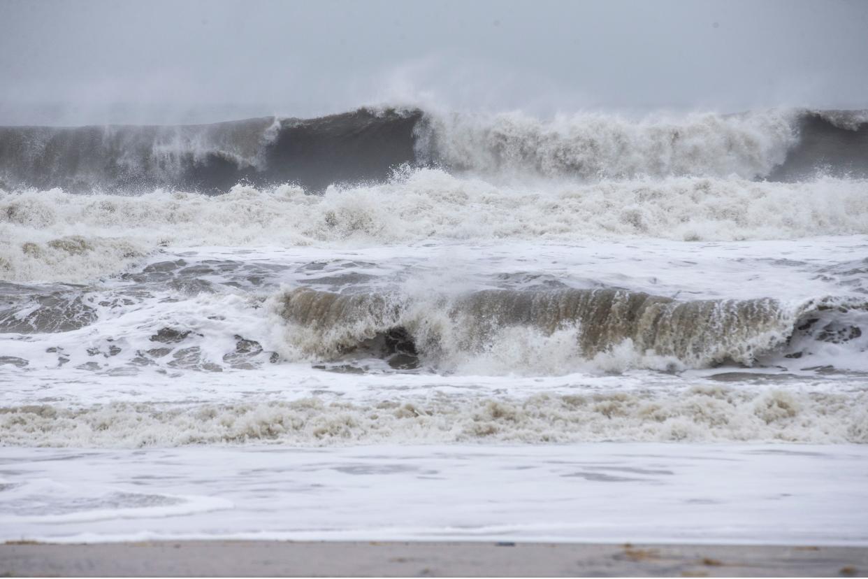 Huge waves generated by a powerful storm wash out sand and dune fencing as high tide arrives late morning.         Seaside Heights, NJTuesday, February, 2, 2021  