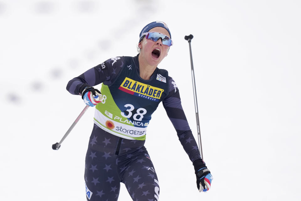 Jessie Diggins, of the United States, crosses the finish line in the Women's Cross Country Interval Start 10 KM Free event at the Nordic World Championships in Planica, Slovenia, Tuesday, Feb. 28, 2023. (AP Photo/Matthias Schrader)