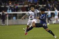 Toronto FC midfielder Jahkeele Marshall-Rutty, left, vies for the ball against San Jose Earthquakes midfielder Michael Baldisimo (55) during the first half of an MLS soccer match in San Jose, Calif., Saturday, March 25, 2023. (AP Photo/Josie Lepe)