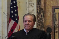 Judge Milan D. Smith Jr. sits before hearing arguments at the Ninth Circuit Court of Appeals in San Francisco, Monday, Nov. 14, 2022. Apple is heading into a courtroom faceoff against Epic Games, the company behind the popular Fortnite video game, reviving a high-stakes antitrust battle over whether the digital fortress shielding the iPhone's app store illegally enriches the world's most valuable company while stifling competition. (AP Photo/Jeff Chiu)