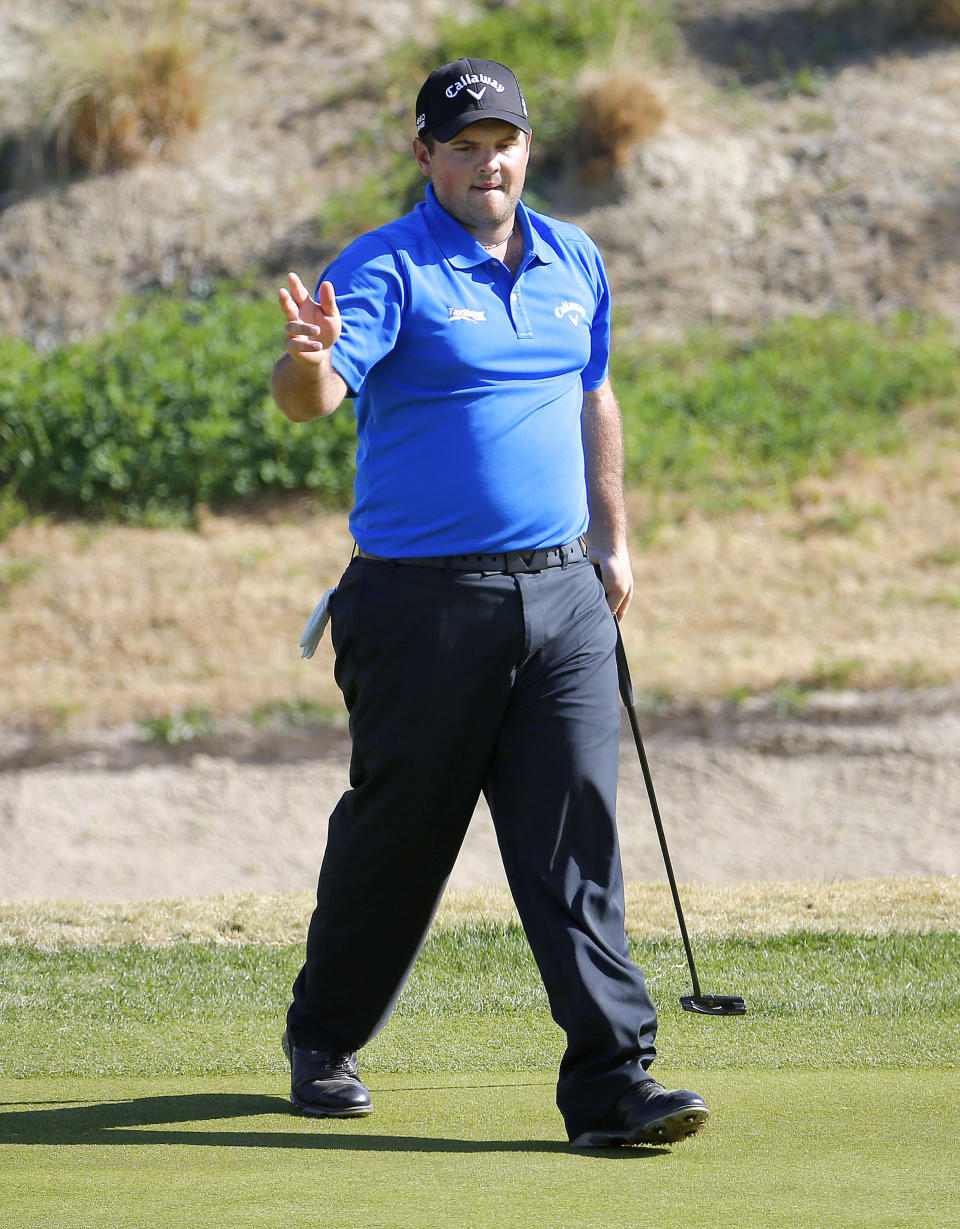 Patrick Reed acknowledges the gallery after making a birdie putt on the seventh green during the third round of the Humana Challenge PGA golf tournament on the Nicklaus Private course at PGA West, Saturday, Jan. 18, 2014, in La Quinta, Calif. Reed shot a 9-under par for the third day in a row and is 27-under par going into the final round. (AP Photo/Matt York)