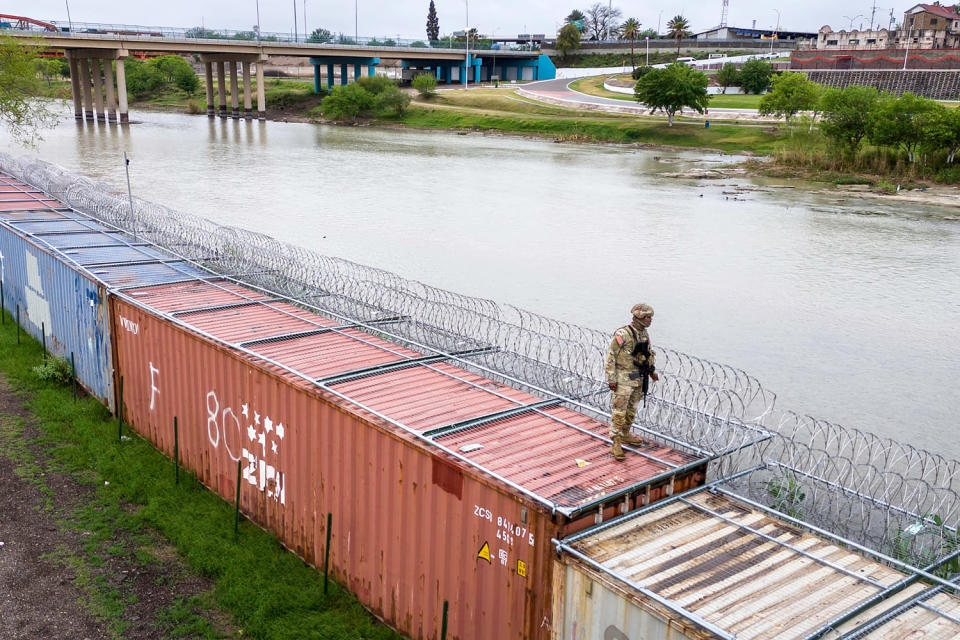 Image: BESTPIX - Panoramic View Of The Borderlands: Southwestern U.S. And Mexico security border patrol razol wire shipping containers (John Moore / Getty Images)