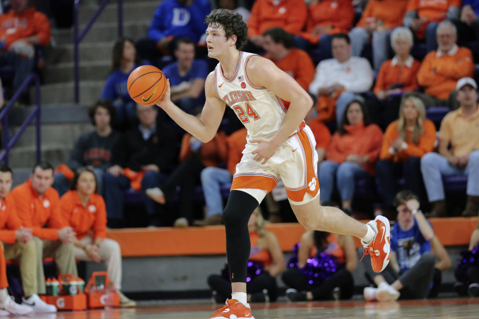 Clemson center PJ Hall (24) looks to pass during the first half of an NCAA college basketball game against Duke in Clemson, S.C., Saturday, Jan. 14, 2023. (AP Photo/Artie Walker Jr.)