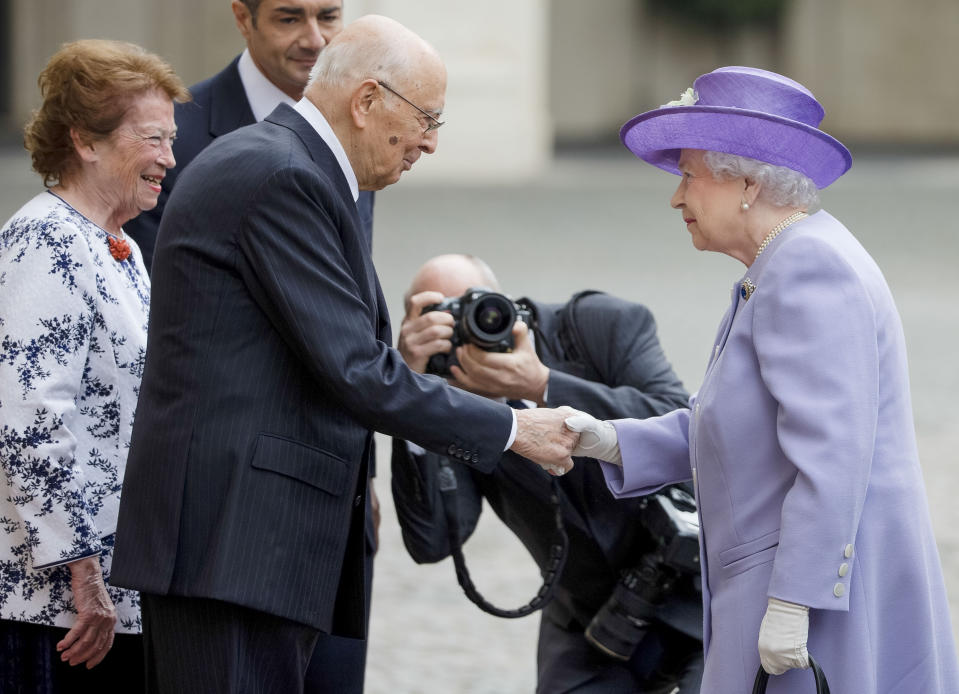 FILE - Queen Elizabeth II, right, is greeted by Italian President Giorgio Napolitano and his wife Clio, left, as she arrives at Rome's Quirinale Presidential Palace during a one-day visit to Italy and the Vatican, Thursday, April 3, 2014. Giorgio Napolitano, the first former Communist to rise to Italy’s top job — president of the Republic — and the first president to be re-elected, has died Friday, Sept. 22, 2023. He was 98. (AP Photo/Alessandra Tarantino, File)