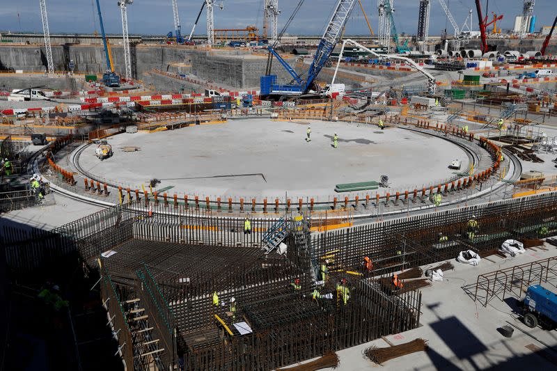 FILE PHOTO: Workers at the nuclear reactor area under construction, are seen at Hinkley Point C nuclear power station site, near Bridgwater