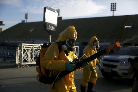 Municipal workers spray insecticide at Sambodrome in Rio de Janeiro, Brazil, January 26, 2016. REUTERS/Pilar Olivares