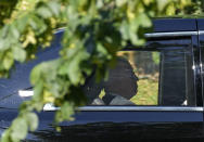 US President Joe Biden passes by in his car on the way to the Intercontinental Hotel in Geneva, Switzerland in Geneva, Switzerland, Tuesday, June 15, 2021. (AP Photo/Markus Schreiber)