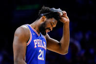 Philadelphia 76ers' Joel Embiid lifts up his mask during the first half of Game 3 of an NBA basketball second-round playoff series against the Miami Heat, Friday, May 6, 2022, in Philadelphia. (AP Photo/Matt Slocum)