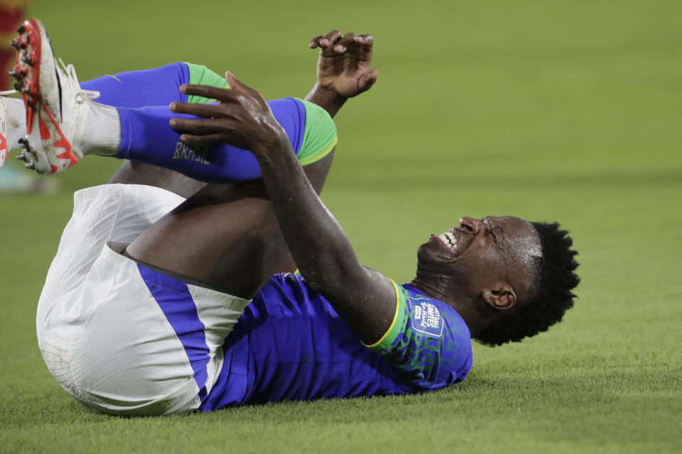 Brazil's Vinicius Junior grimaces in pain during a qualifying soccer match for the FIFA World Cup 2026 against Colombia at Roberto Melendez stadium in Barranquilla, Colombia, Thursday, Nov. 16, 2023. (AP Photo/Ivan Valencia)