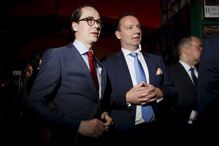 Chairman Carl Haglund (L) of the Swedish People's Party attends the party's parliamentary elections reception in Helsinki April 19, 2015. REUTERS/Roni Rekomaa/Lehtikuva