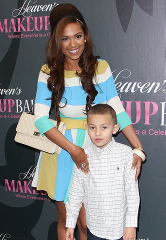 <p>Maury Phillips/WireImage</p> Erica Mena and her son King attend the launch party for Erica Mena new cosmetic line "Lady J Cosmetics" in 2013