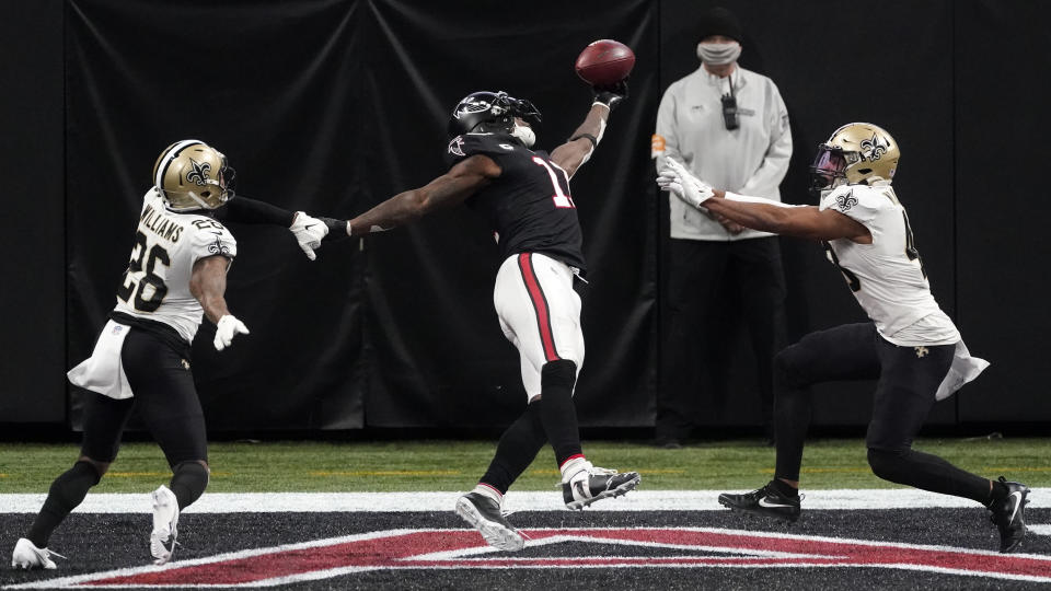 New Orleans Saints cornerback P.J. Williams (26) and New Orleans Saints defensive back J.T. Gray (48) defend Atlanta Falcons wide receiver Julio Jones (11) during the second half of an NFL football game, Sunday, Dec. 6, 2020, in Atlanta. (AP Photo/John Bazemore)