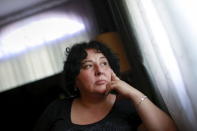 Inez Szczupak, whose son Martin died of a drug overdose in upstate New York, looks out a window at her home in the Staten Island borough of New York August 19, 2015. Picture taken August 19, 2015.REUTERS/Shannon Stapleton