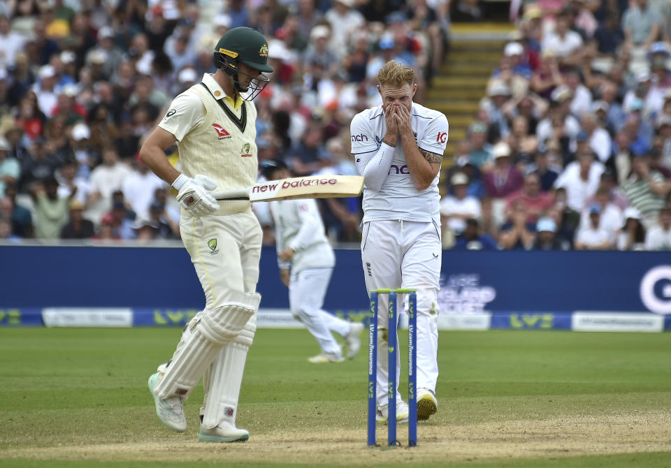 England's Ben Stokes, right, reacts along side Australia's Pat Cummins, left, during day five of the first Ashes Test cricket match, at Edgbaston, Birmingham, England, Tuesday, June 20 2023. (AP Photo/Rui Vieira)
