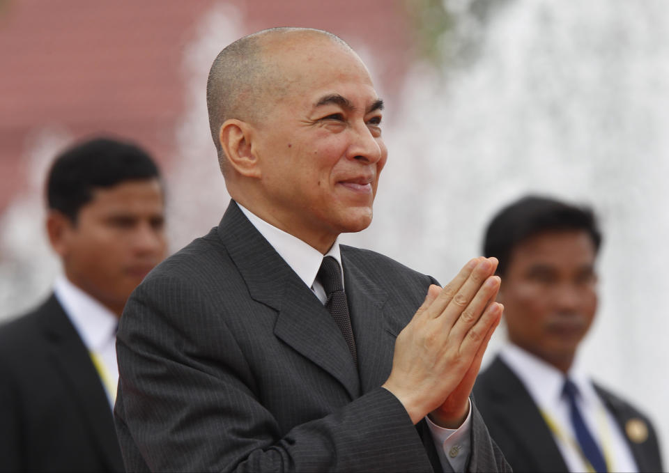 Cambodia's King Norodom Sihamoni, center, greets his government officers during the Independence Day celebrations in Phnom Penh, Cambodia, Thursday, Nov. 9, 2017. Sihamoni is joined by civil servants and students to mark the country's 64th Independence Day. The country gained independence from France on Nov. 9, 1953. (AP Photo/Heng Sinith)