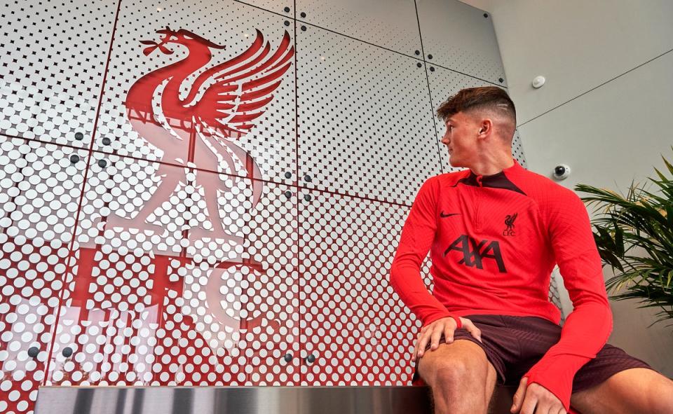 New Liverpool signing Calvin Ramsey signs for the club at AXA Training Centre (Liverpool FC via Getty Images)