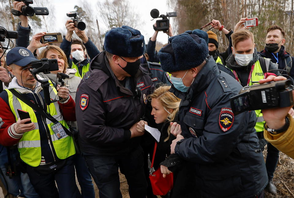 Russian police officers detain Anastasiya Vasilyeva, a doctor and ally of Kremlin critic Alexey Navalny, near the IK-2 corrective penal colony, where Navalny is serving a prison sentence, in the town of Pokrov, Russia, on April 6, 2021. / Credit: MAXIM SHEMETOV/REUTERS