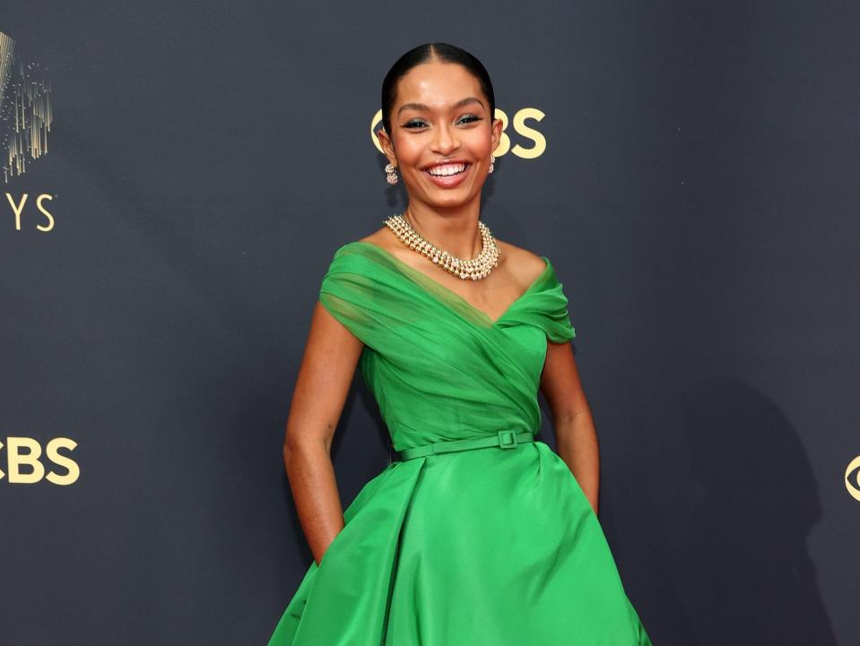 Yara Shahidi wears a green dress at the Emmys.