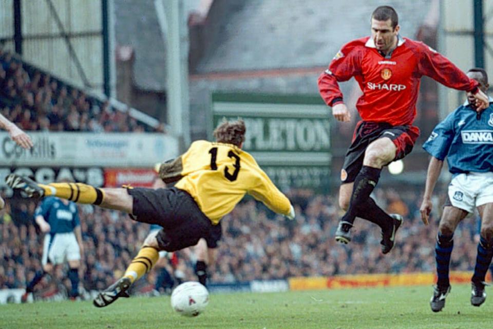 Manchester United's Eric Cantona slots home his side's second goal, past Everton keeper Paul Gerrard during their English FA  Premier league match at Goodison Park in Liverpool Saturday March 22, 1997. Manchester United won the match 2-0. (AP Photo / Dave Kendall, PA) **UNITED KINGDOM OUT**