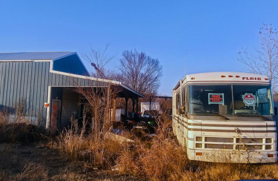 One of Joseph Lloyd Kennedy's salvage yards, located at 1205 W 20th St., stands neglected, with "Stay Out" spray-painted on the door of its main building, as seen on Dec. 5 in Okmulgee.