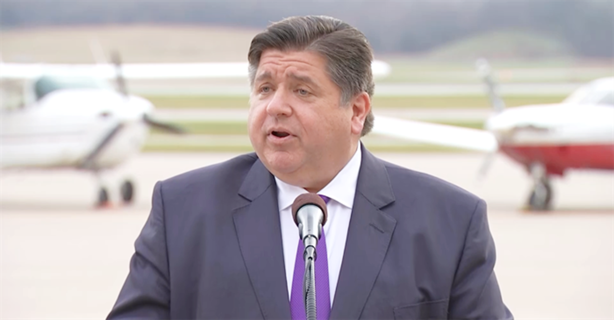 Gov. JB Pritzker speaks at the Quad Cities International Airport Wednesday in announcing $94 million in state grants for airports across Illinois.