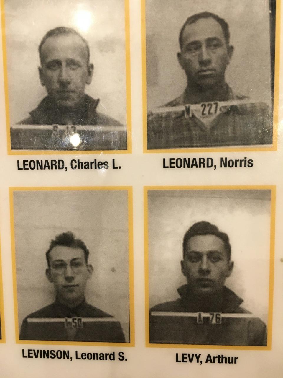 A picture of Arthur Levy's badge (bottom right) worn at the Manhattan Project's Los Alamos Laboratory, as shown in a binder at the  Bradbury Science Museum.