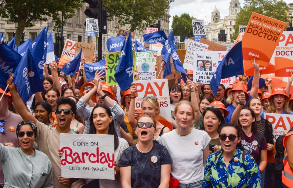 Junior doctors rally outside Downing Street in a strike over pay. FTSE down on Monday