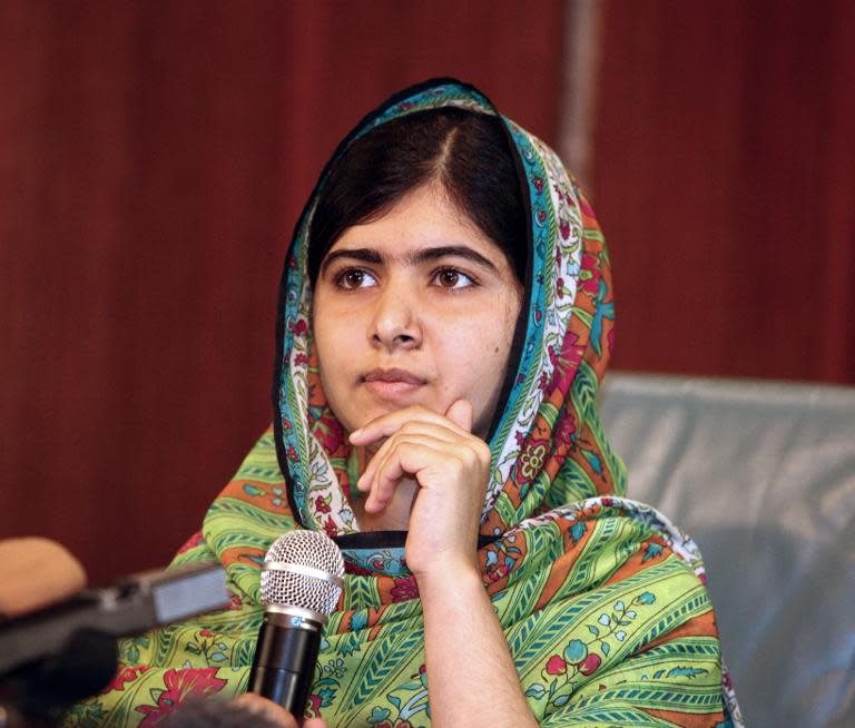 Pakistani education activist and 2014 Nobel Peace Prize winner Malala Yousafzai gives a press conference on July 14, 2014 after meeting with the Nigerian president in Abuja