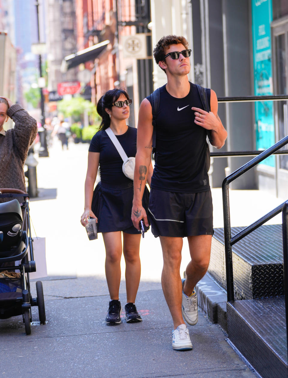 Camila and Shawn walking together on the street