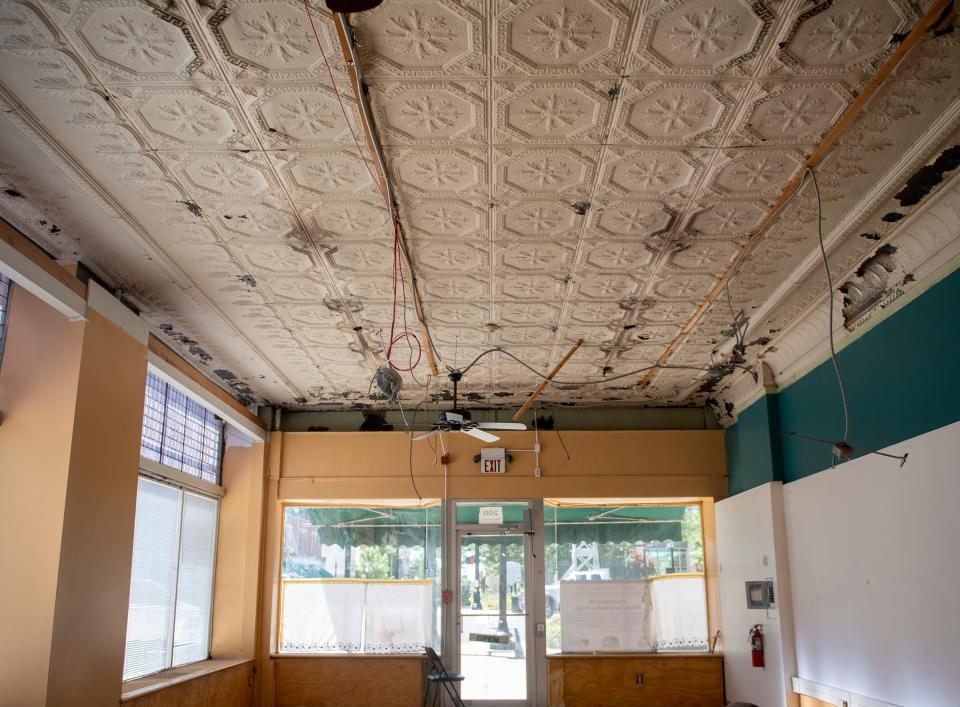 The drop ceiling in the space of the former Caritas Cafe in Riddle Block 9 in downtown Ravenna was removed to show the original tin ceiling.