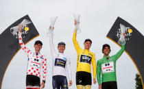 Cycling -July 23, 2017 - Team Sunweb rider and polka-dot jersey Warren Barguil of France, Orica-Scott rider and white jersey Simon Yates of Britain, Team Sky rider and yellow jersey Chris Froome of Britain and Team Sunweb rider and green jersey Michael Matthews of Australia on the podium. REUTERS/Benoit Tessier