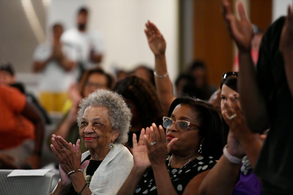 Audience members clap as Glenis Redmond, City of Greenville Poet Laureate, recites poetry at the Prisma Health Welcome Center at Unity Park during the third annual Juneteenth at Unity Park celebration on Wednesday, June 19, 2024.