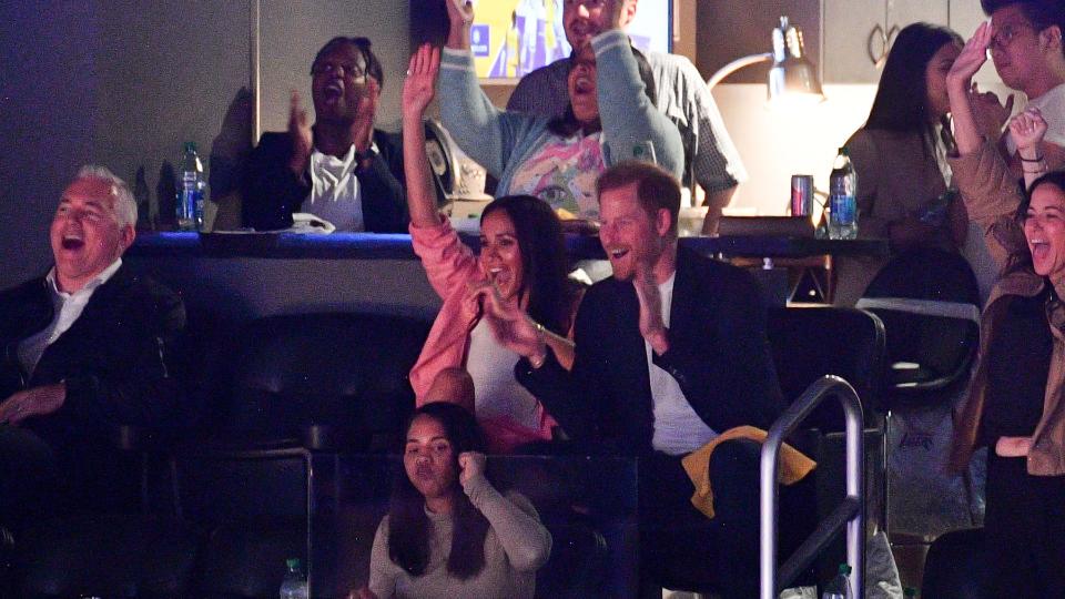 <p> In her first public appearance since the release of her and Prince Harry's Netflix docuseries Harry & Meghan, Meghan decided to leave the stresses of life in the United Kingdom behind as she partook in a very American pastime - basketball. </p> <p> She cheered on the Los Angeles Lakers wearing a matching blazer and shorts set from the fashion label, Staud. </p> <p> We love that, in her eye-catching salmon co-ord set, she didn't hesitate in cheering and hollering her support for the team. </p>