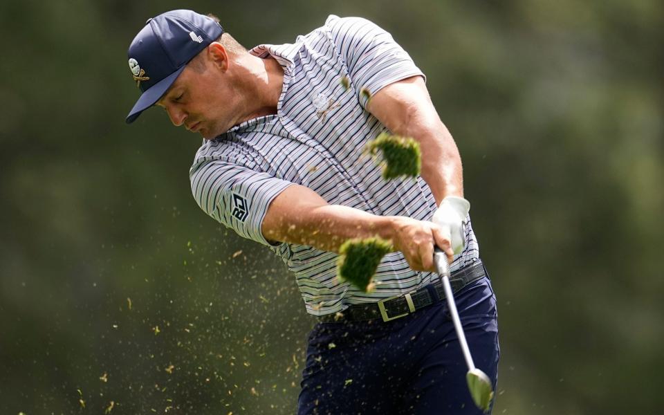 Bryson DeChambeau hits his tee shot on the fourth hole during the first round at the Masters golf tournament