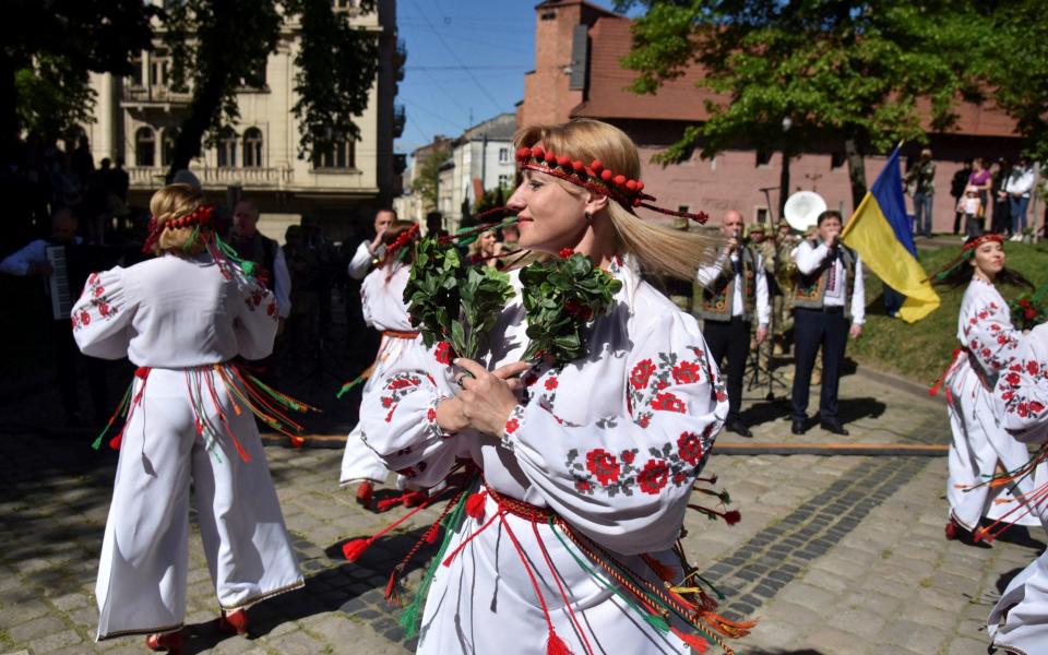 Women perform during Vyshyvanka Day celebrations in Lviv, Ukraine on May 19, 2022. - Pavlo Palamarchuk/Reuters