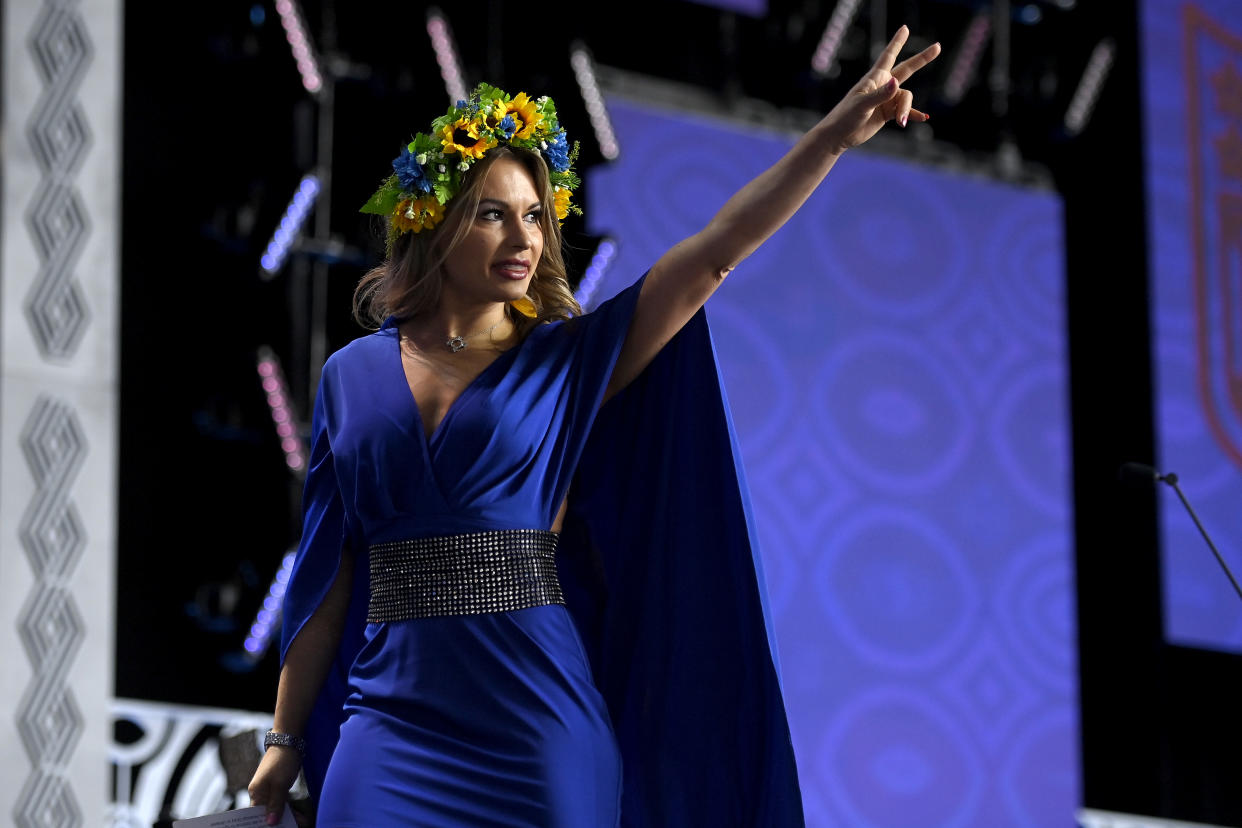 LAS VEGAS, NEVADA - APRIL 28: Jenny Arata of Ukraine gives the peace sign onstage prior to round one of the 2022 NFL Draft on April 28, 2022 in Las Vegas, Nevada. (Photo by David Becker/Getty Images)