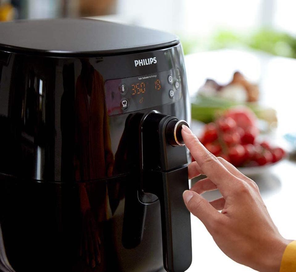 The Philips air fryer has four preset programs for the most popular dishes. Image via Amazon.